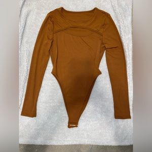 Burnt orange onesie/bodysuit